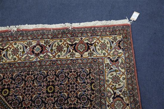A modern Persian rug, 8ft by 5ft 7in.